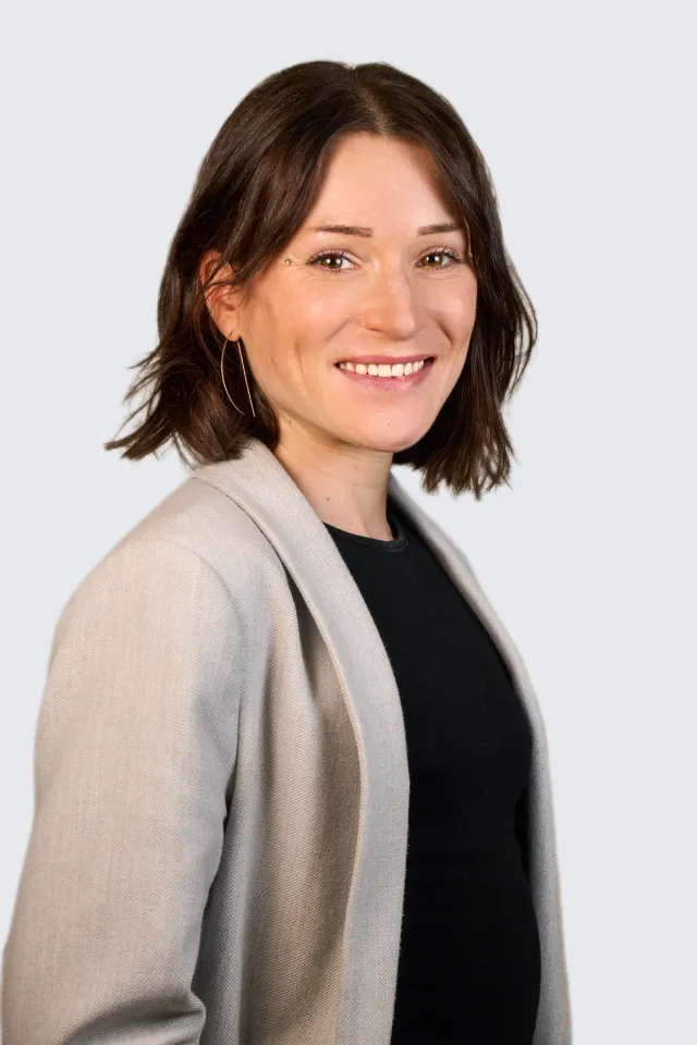 Portrait of Maureen Green smiling against a neutral background